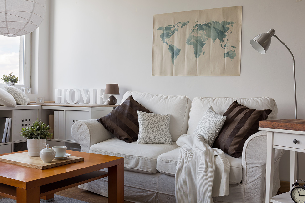 Sofa with colorful pillows in room