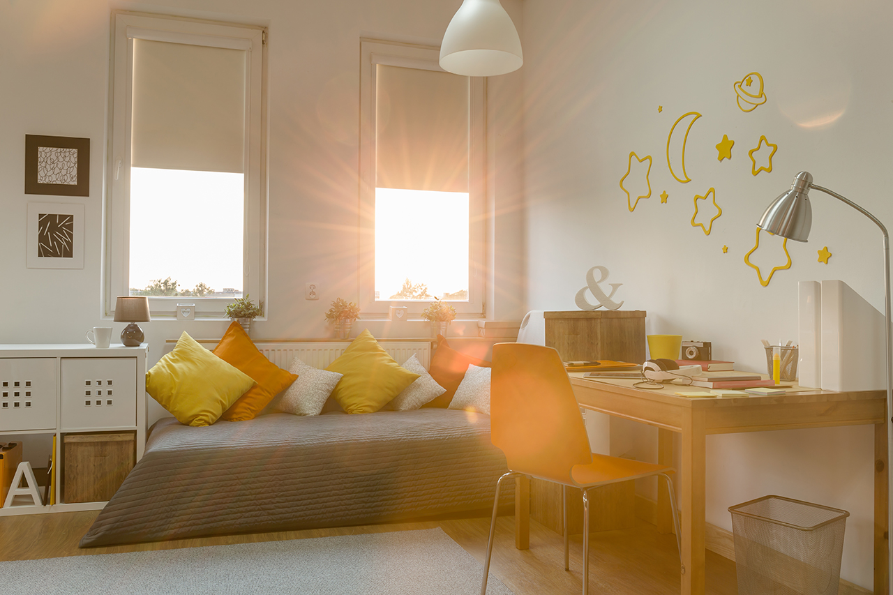 Modern-teen-room at sunrise with sunlight coming through the window